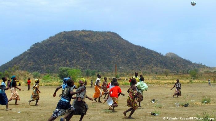 Girls playing football inside the Minawao refugee camp | Photo: Reinnier Kaze / AFP / Getty images