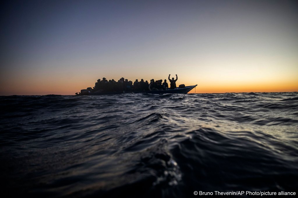 Migrants on board an overcrowded rubber dinghy in the Mediterranean Sea waiting to be rescued by the Open Arms charity ship on February 12, 2021 | Photo: Bruno Thevenin/picture alliance/dpa/AP