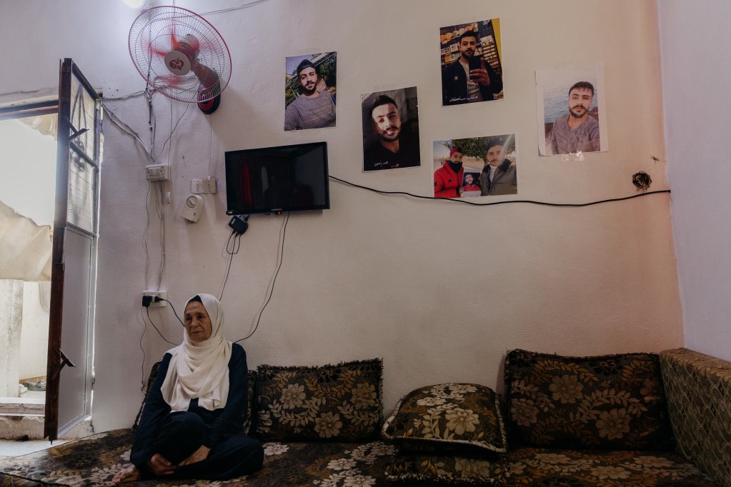 Mohamed went missing on October 31, 2023, at the age of 26 after going to sea. His mother Aeda displays photos of him in her living room. Damascus, Syria, September 23, 2025 | Photo: Valentina Camu/Divergence