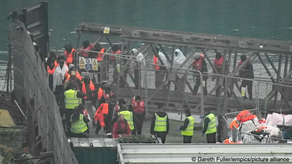 A group of people thought to be migrants are brought in to Dover, Kent, from a Border Force vessel following a small boat incident in the Channel on March 23 | Photo: Gareth Fuller / empics / picture alliance