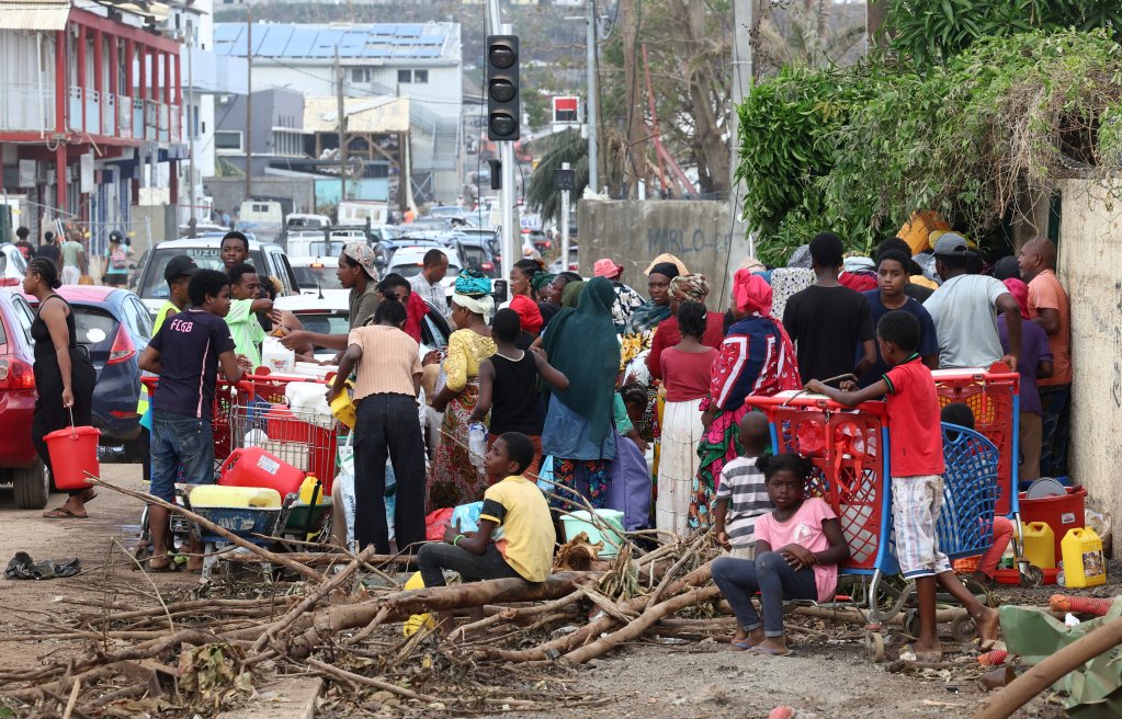 File photo: People wait to collect water in Mayotte in the aftermath of Cyclone Chido, which hit the island earlier in December 2024 | Photo: Reuters