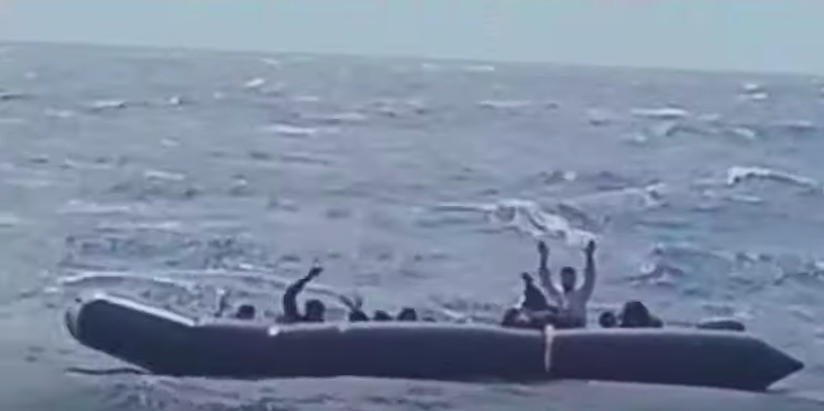 File photo for illustration: An inflatable boat with more than 20 people on board off the coast of Rhodes on Sunday, May 22, 2022 | Screenshot from YouTube channel of the Hellenic Coast Guard