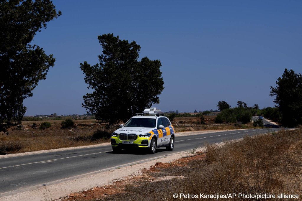 A police customs vehicle travels near the British Dhekelia military base on Cyprus on July 6, 2021 | Photo: Petros Karadjias/ AP