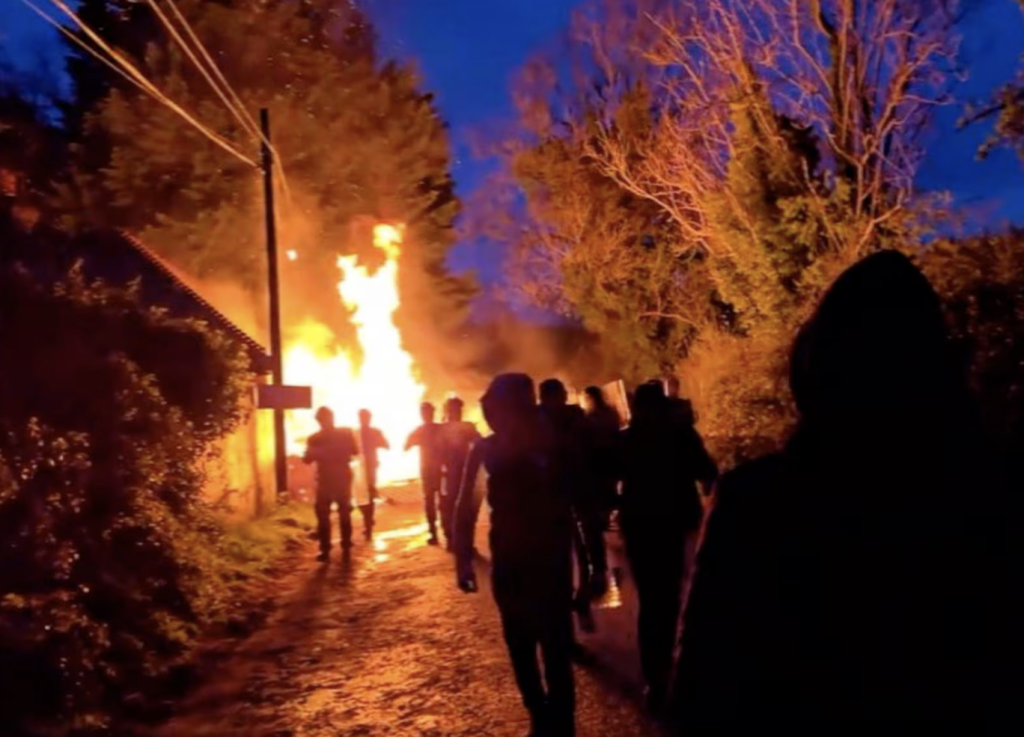 A screenshot from a social media post on X, reproduced by the Irish Times, showing people and a fire at the Trudder House site in Newtown, County Wicklow, Ireland on April 25, 2024 | X post @IrishTimes