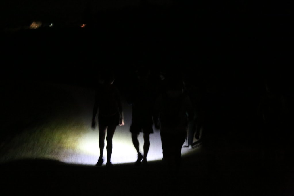 Participants of the night hike lighting the way with their head torches | Photo: Paul Huf
