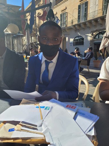 Amara reads some of the letters of support for the three which have been sent to Amnesty | Photo: Rebecca White / Amnesty International