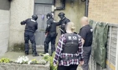 File photo used as illustration: NCA officers in the UK raid four homes to arrest suspected migrant smugglers | Source: National Crime Agency Press Release