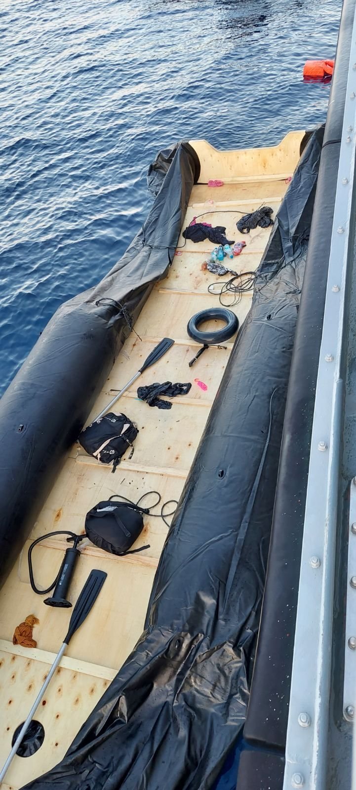 A picture supplied by the Greek coast guard shows a dinghy partially deflated alongside the coast guard vessel | Source: Hellenic Coast Guard Press Release