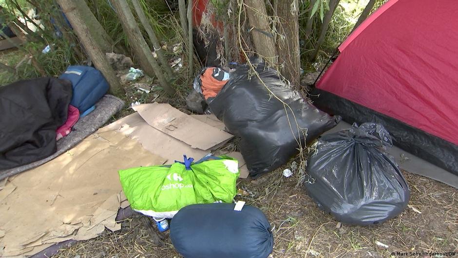 Police come by often to clear the makeshift camps