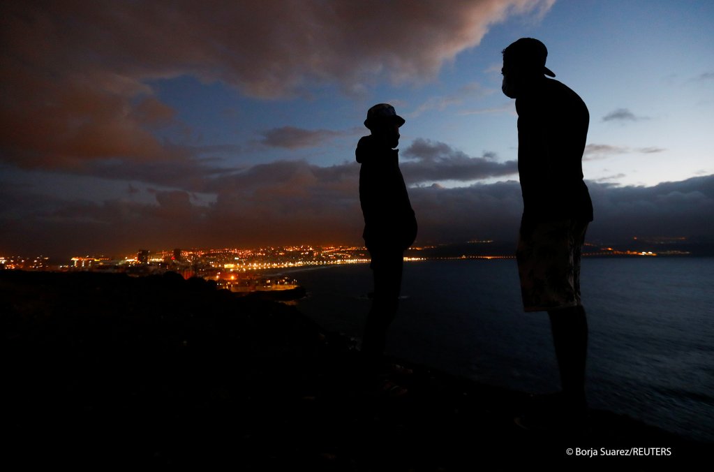 Two migrants at a makeshift camp in the mountains near Las Palmas, Gran Canaria, on March 7, 2021 | Photo: Borja Suarez/Reuters