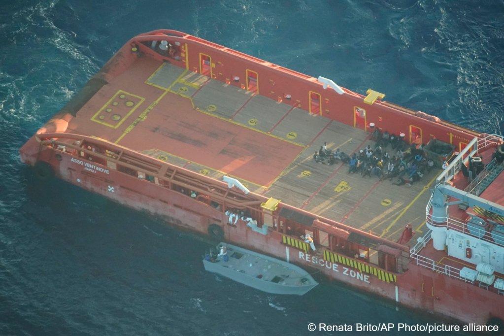 Migrants on the deck of the Italian supply vessel, Asso Ventinove as seen from aboard the Seabird, an NGO aircraft, after they were rescued from aboard a migrant boat on Saturday, October 2, 2021 | Photo: AP Photo/Renata Brito