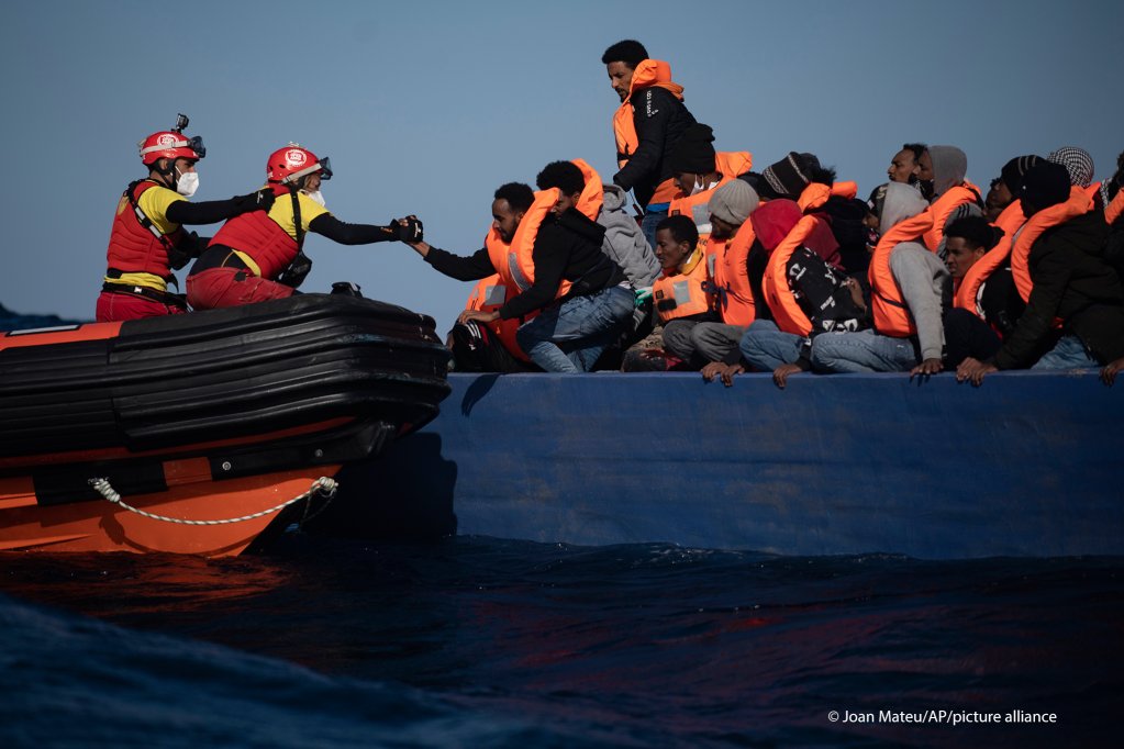 File photo: Migrants from Eritrea, Egypt, Syria and Sudan are assisted by aid workers of the Spanish NGO Open Arms, after fleeing Libya on board a wooden boat in the Mediterranean Sea on January 2, 2021 | Photo: Joan Mateu/AP Photo