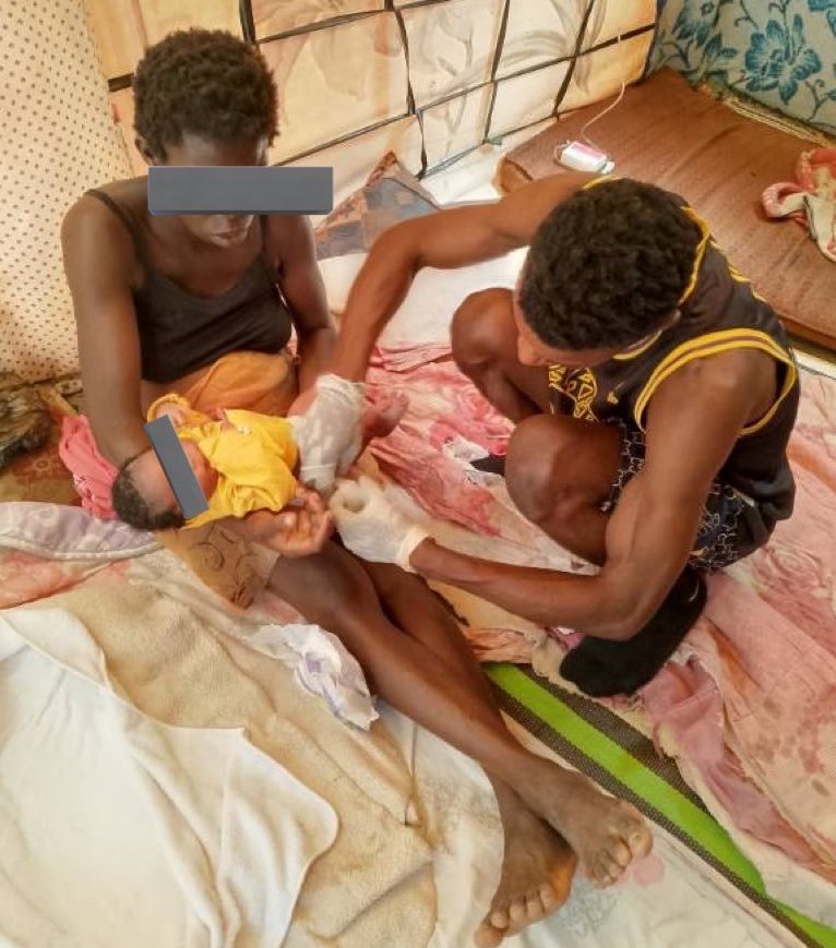 Sanitation and medical facilities are almost non-existent in the migrant camps in Tunisia, here one migrant who is a doctor tries to help a woman and her child | Photo: private