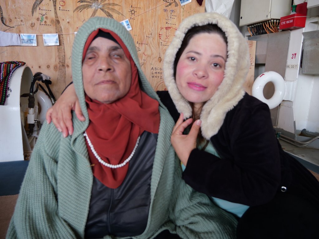 Nour (pictured right) left Syria to seek treatment for her aunt (pictured left) who was left blinded in a shell attack | Geo Barents, Central Mediterranean Sea, February, 2024 | Photo: Sou-Jie van Brunnersum