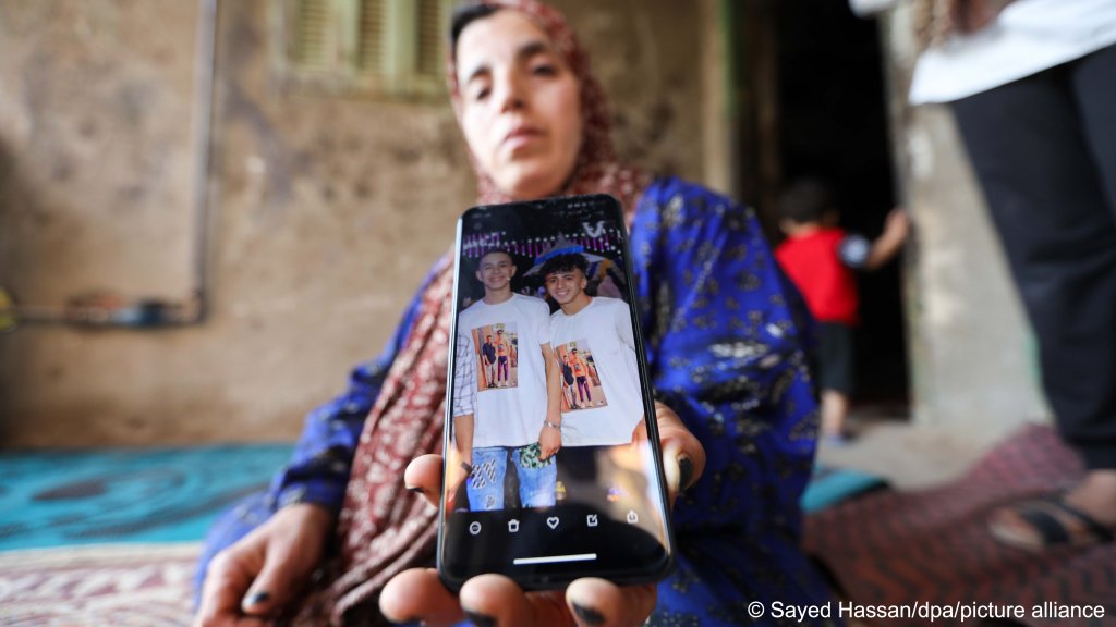 From file: The Mother of Muhammad Ahmed Al-Sayed from the village of Ibrash Al-Sharqiya, Egypt is among the missing after the Greek boat sank on June 14, holds her son's photo in front of their home. Photo: Sayed Hasan/dpa/Picture Alliance