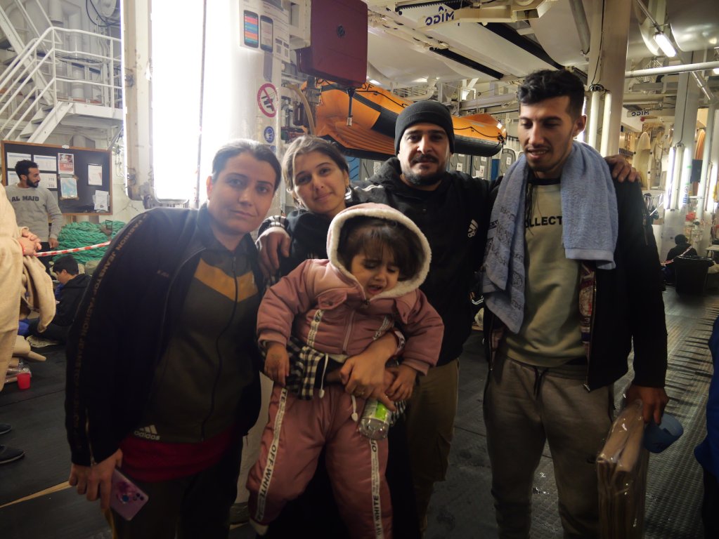 Directly after their sea rescue, a Kurdish family from Syria asked for their photo to be taken and published so that their families would know they are safe | Geo Barents Central Mediterranean Sea, February, 2024 | Photo: Sou-Jie van Brunnersum