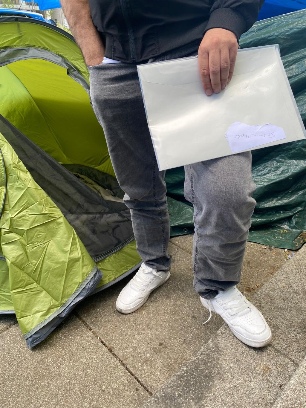 Karim shows the documents issued by Irish authorities when he submitted his asylum application. Dublin, July 3, 2024 | Photo: InfoMigrants
