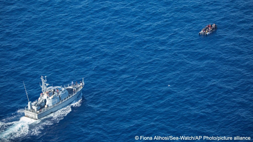 In this handout photo released by German non- governmental organization Sea- Watch on October 25, 2022, migrants attempting to cross the Mediterranean Sea on a rubber boat to Europe are seen during an interception by a Libyan coast guard ship in international waters | Photo: picture alliance
