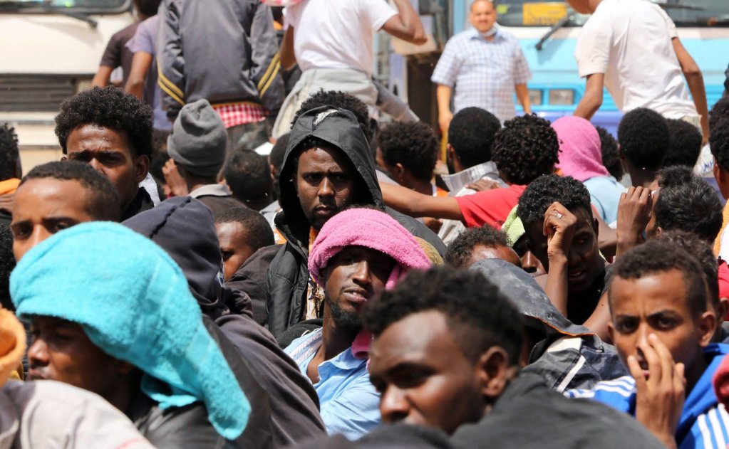 File photo used as illustration: African migrants sit in a detention center in the al-Karem district in Misrata east of Tripoli, Libya | Photo: EPA/STR