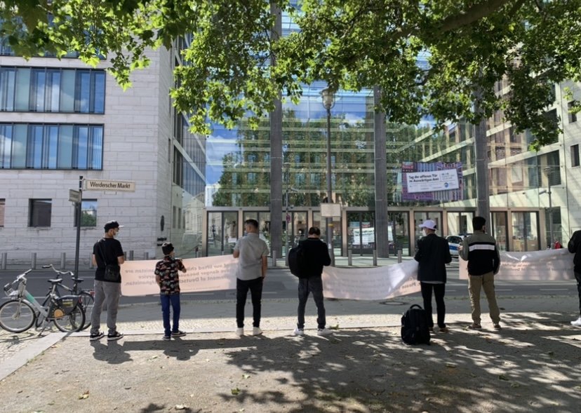 Protestors stood outside Germany's Ministry of Foreign Affairs in Berlin. | Photo: Clare Roth