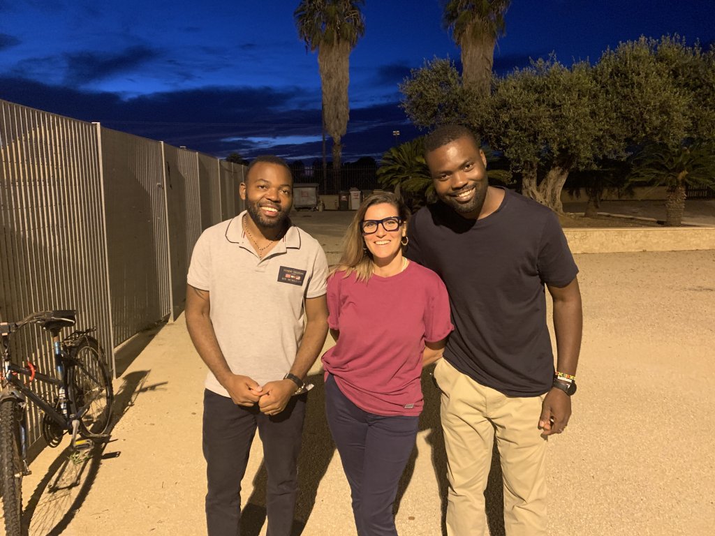 Albert Kalenda Kabongo (L), Simona Scovazzo (M) and Jonny Affun (R) all live and work in the area as cultural mediators. They go regularly into the Campobello di Mazara camp and know many people there | Photo: Emma Wallis / InfoMigrants