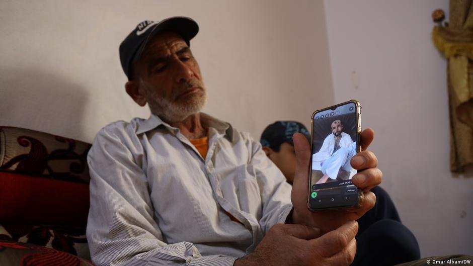 "Lebanon is hell," says Syrian man Walid Muhammad Abdel-Baqi, as he shows DW a picture of his late son, Walid | Photo: Omar Albam/DW
