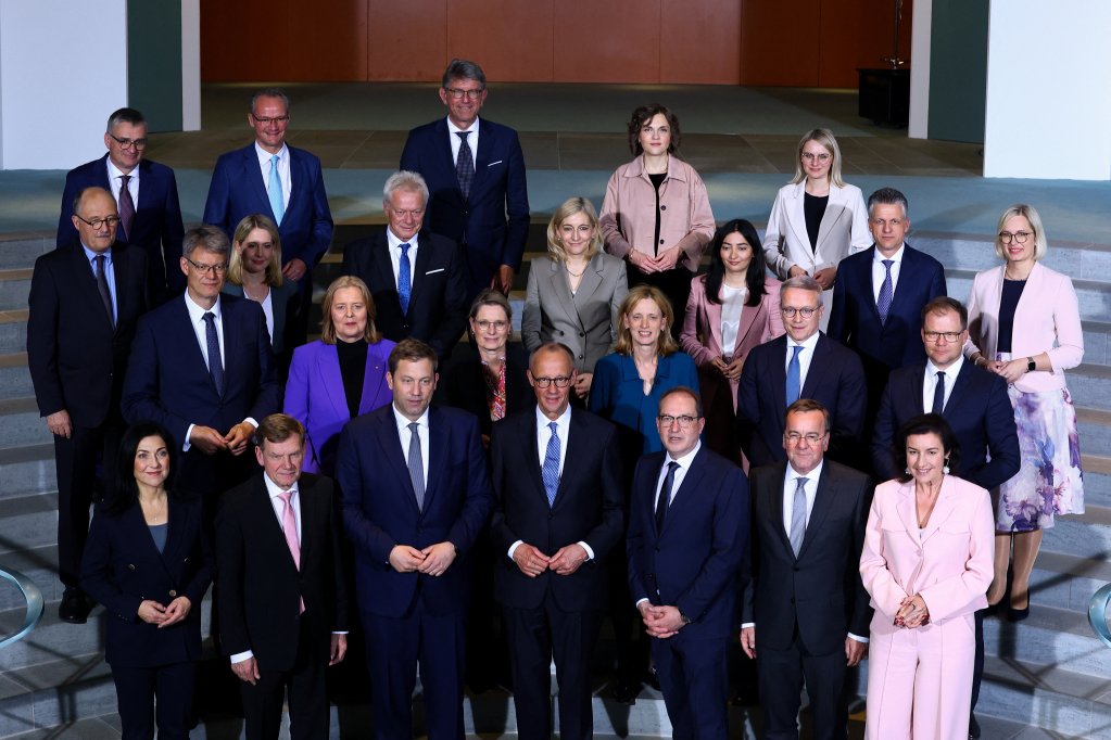 The new German government is led by Friedrich Merz as chancellor (bottom row, middle) and includes interior minister Alexander Dobrindt (standing on the right next to Merz). Both are seen in key figures in moving Germany in a more restrictive direction on asylum policies | Photo: Reuters