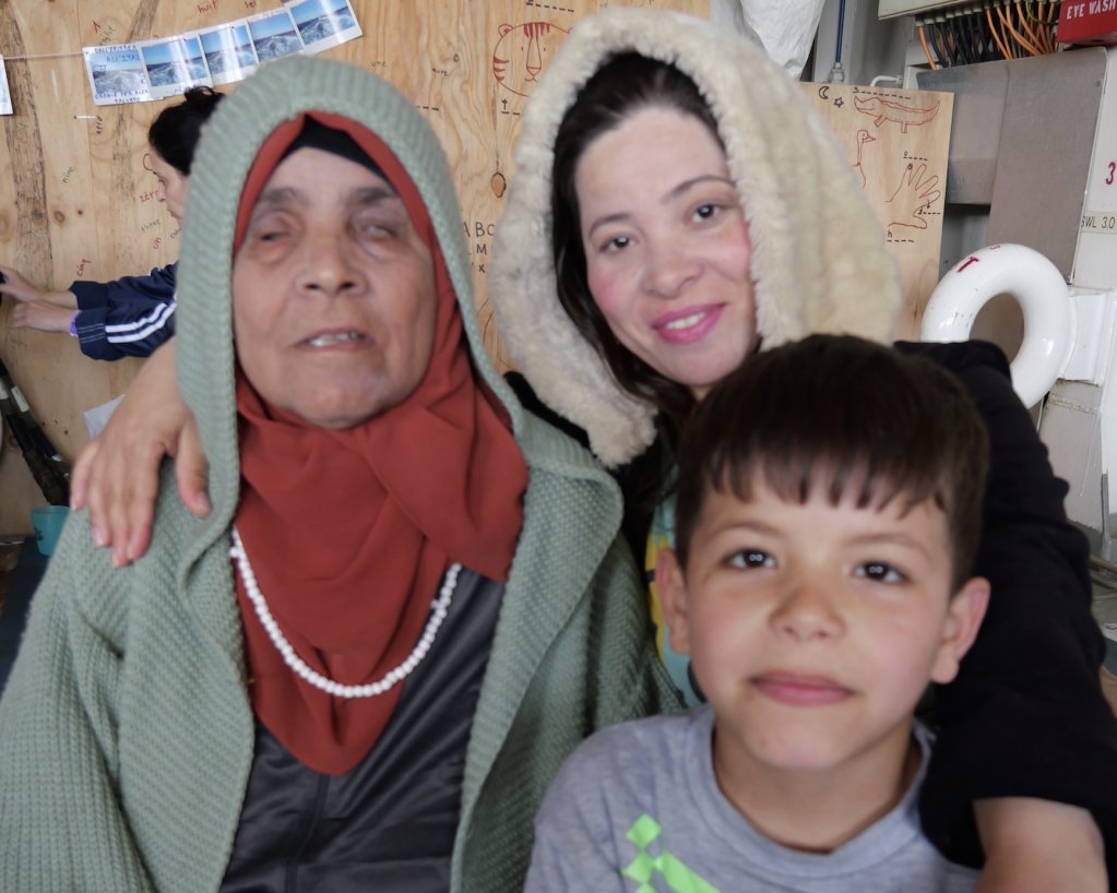 
During her journey from Syria to Libya and across the Mediterranean Sea, this blind elderly lady had to rely on her niece and young grand-nephew to guide her. The Syrian family hopes to find treatment in Europe to hopefully restore some of her vision. | Geo Barents MSF Central Mediterranean Sea February, 2024 | Photo: Sou-Jie van Brunnersum