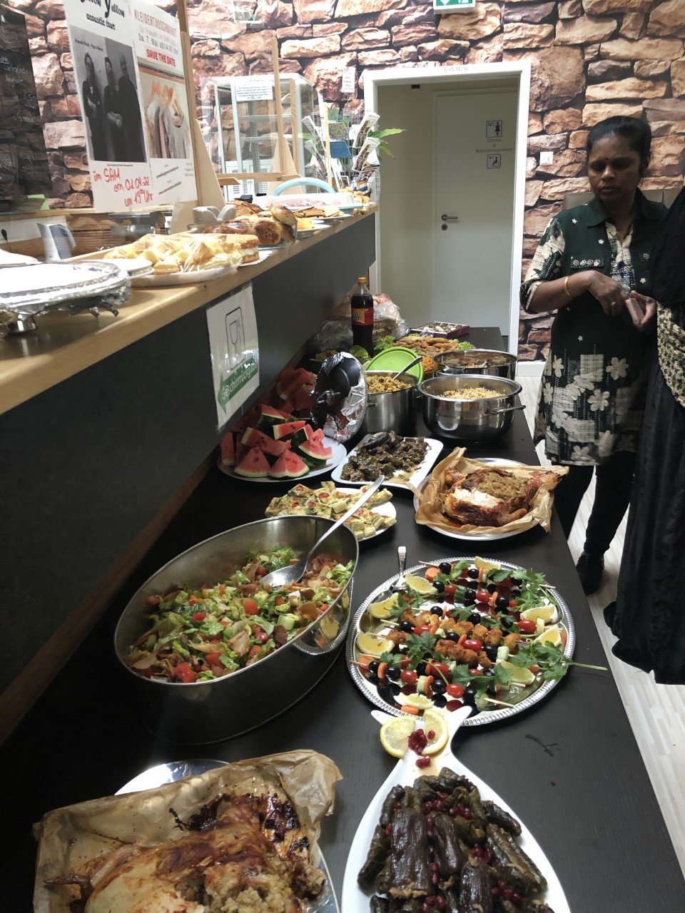 Refugees and migrants at SAM International celebrates the Neyrus/Nayrouz (New Year) at the SAM International cafe in Sinsheim, Germany with lots of delicious food | Photo: Courtesy of SAM International.