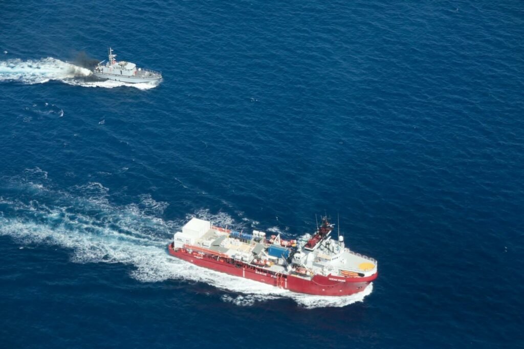 File photo: A vessl of the so-called Libyan coast guard (top left) and migrant rescue ship Ocean Viking | Photo: SOS Mediterranee