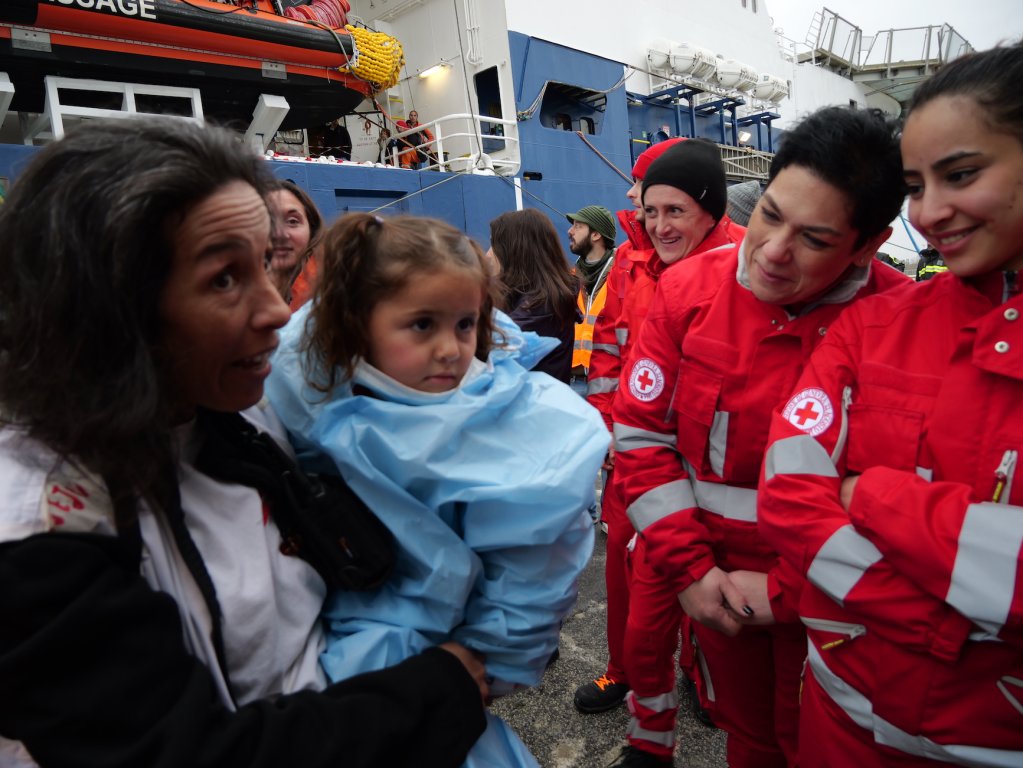 Italian Red Cross volunteers greet the new arrivals in Ravenna, Italy following their disembarkation | February, 2024 | Photo: Sou-Jie van Brunnersum