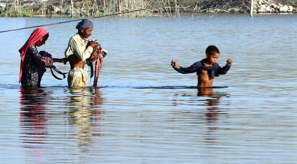 From file: People affected by devastating floods move to higher grounds in Naushahro Feroze District, Sindh province, Pakistan, 15 October 2022 | Photo: Rehan Khan/EPA