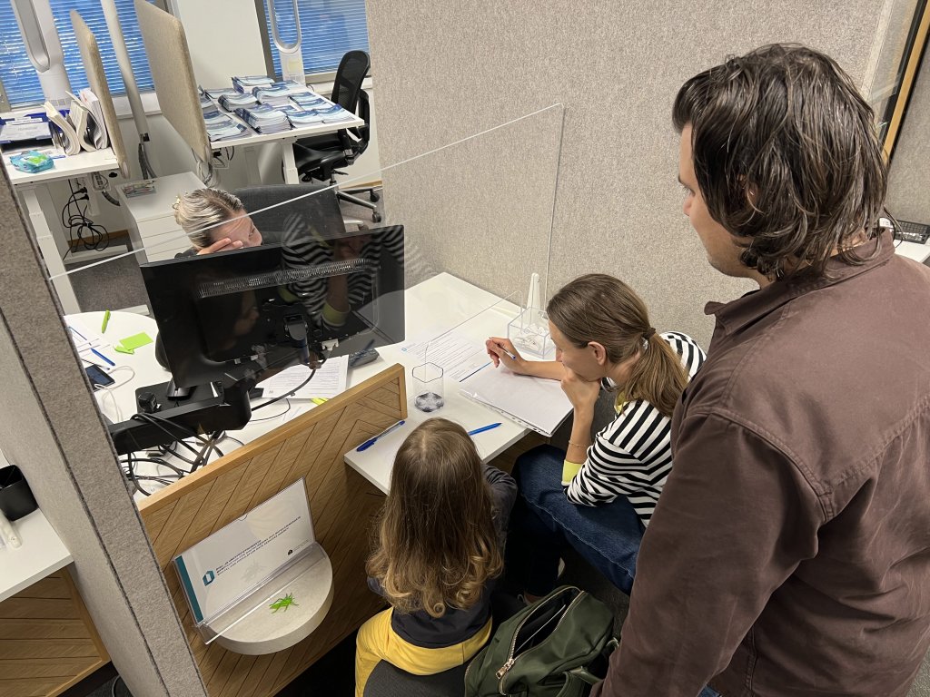 A booth of Finland's Digital and Population Data Services Agency at the International House Helsinki | Photo: Ben Bathke/InfoMigrants