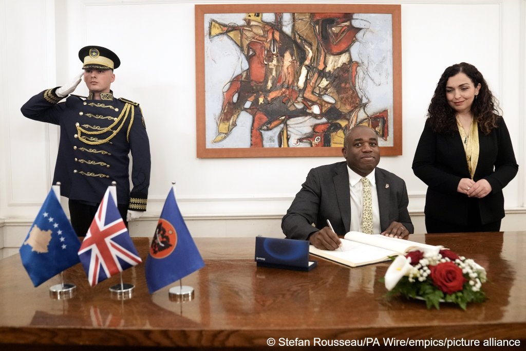 Foreign Secretary David Lammy signs a friendship book with President of Kosovo Vjosa Osmani during his visit to Kosovo and Serbia. The two countries have promised to share information to help tackle migrant smuggling and crime | Photo: Stefan Rousseau/PA Wire/empics/picture alliance