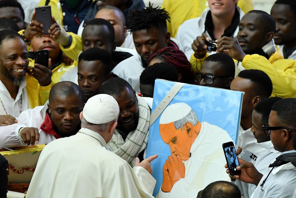 From file: Pope Francis with migrants in 2018. The Pope has often spoken out on behalf of migrants and also arranged to fly some people to Italy on his plane after visits to migrant and refugee camps | Photo: Ettore Ferrari / ANSA