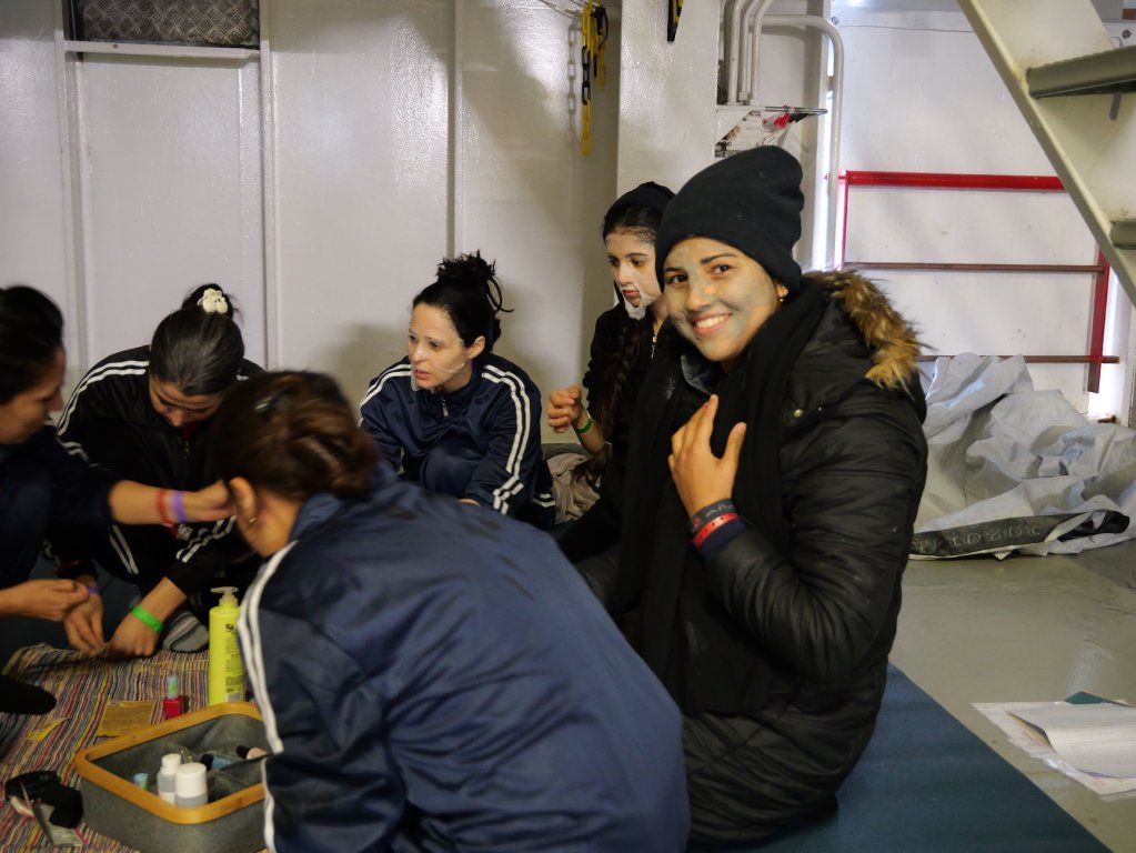 Duaa tries on a mud mask during a beauty and wellness session run by MSF on board the Geo Barents in the Central Mediterranean Sea | February, 2024 | Photo: Sou-Jie van Brunnersum