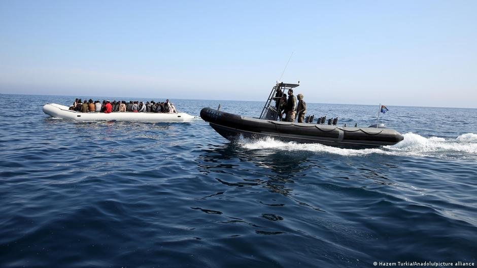 File photo: A Libyan coastguard boat is seen approaching a boat of African migrants in June 2015 | Photo: Hazem Turkia/Anadolu/picture alliance