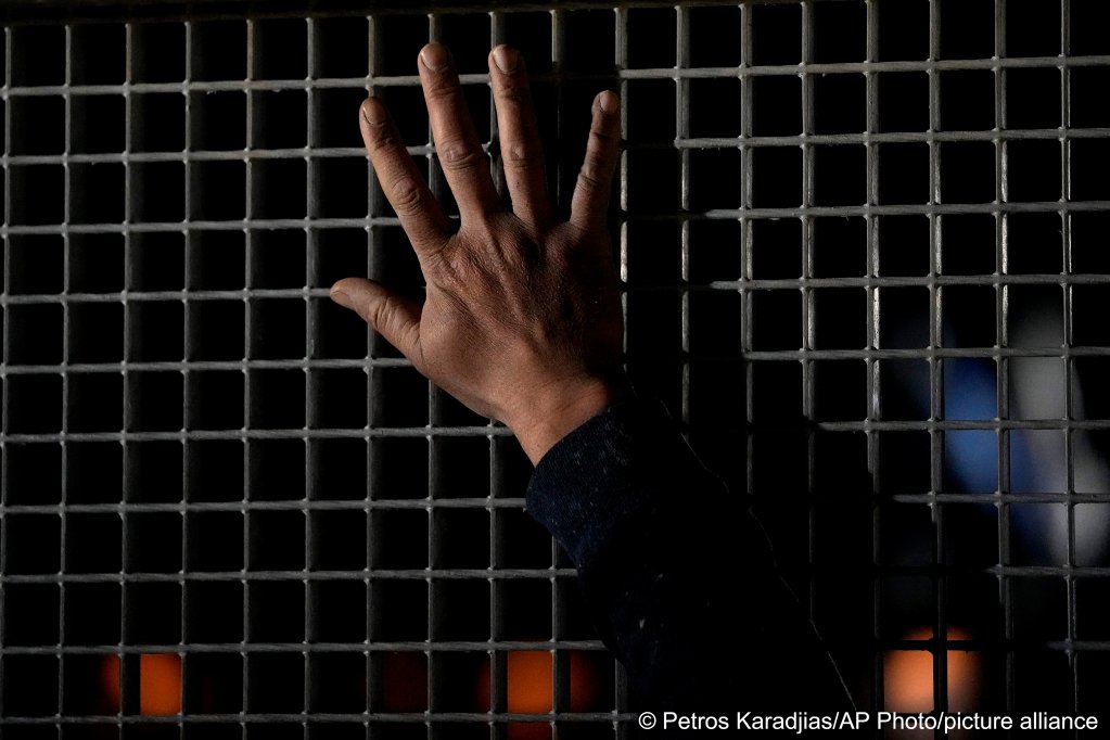File photo: A Syrian man waves to his relatives from Syria as they sit inside a bus at the Pournara migrant reception center in Kokkinotrimithia outside of capital Nicosia | Photo: Petros Karadjias/APPhoto/