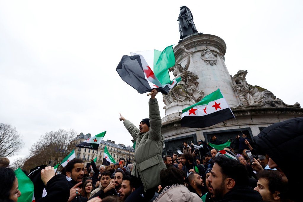 In December 2024, Syrians across Europe celebrated the fall of the Assad regime in their homeland, as seen here at the Place de la Republique in Paris, France, on December 8, 2024 | Photo:Piroschka van de Wouw / Reuters
