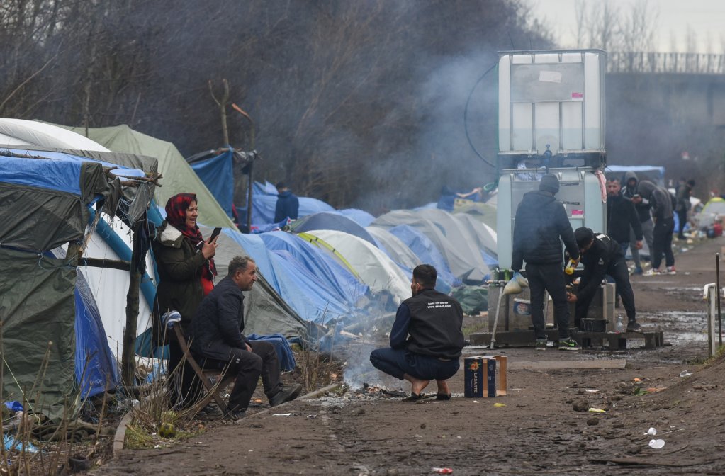 File photo: Migrants in the Grande-Synthe camp on February 10, 2022. The camp is known as a place where migrants can get in touch with smugglers arranging Channel boat crossings | Photo: Mehdi Chebil / InfoMigrants