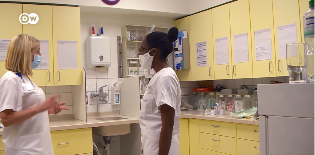 From file: Iyaloo Akuunda is a qualified nurse who migrated from Namibia to Germany for work and featured in a DW documentary | Source: Screenshot DW Documentary