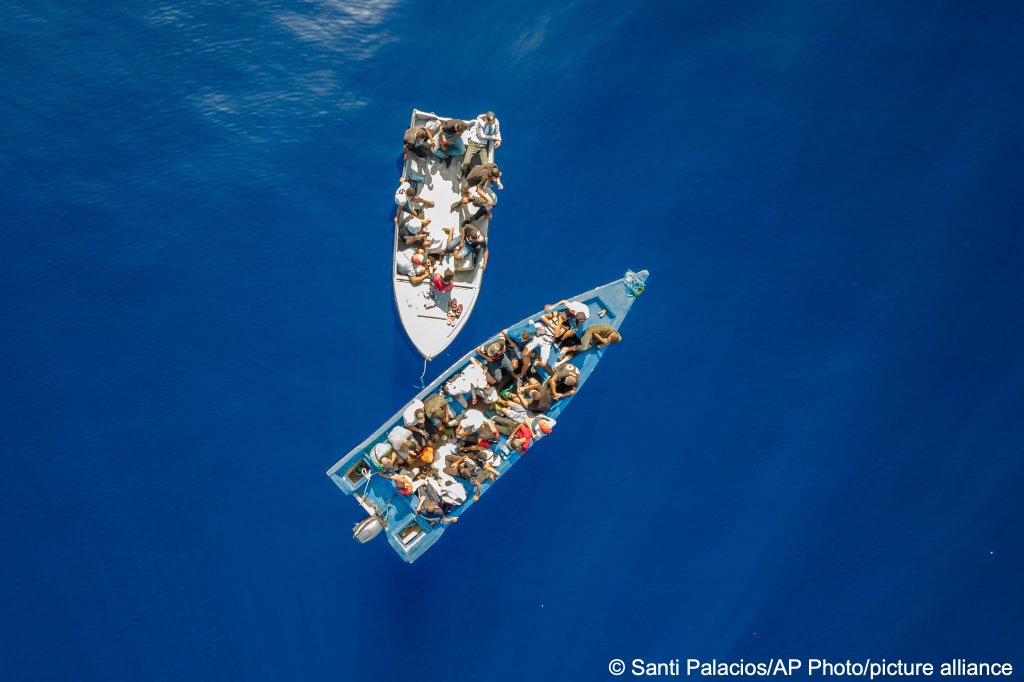 Migrants waiting to be assisted by crew members of Open Arms in waters off the Italian island of Lampedusa on Thursday on July 29, 2021 | Photo: AP Photo/Santi Palacios/Picture-alliance