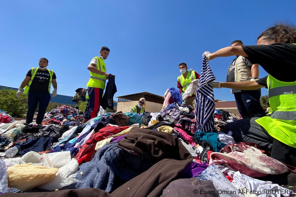 Volunteers from the Beltrees YouthMovement sort clothes that are to be distributed to the displaced people, in the aftermath of the floods in Derna, Libya September14, 2023 | Photo: Reuters/Esam OmranAl-Fetori