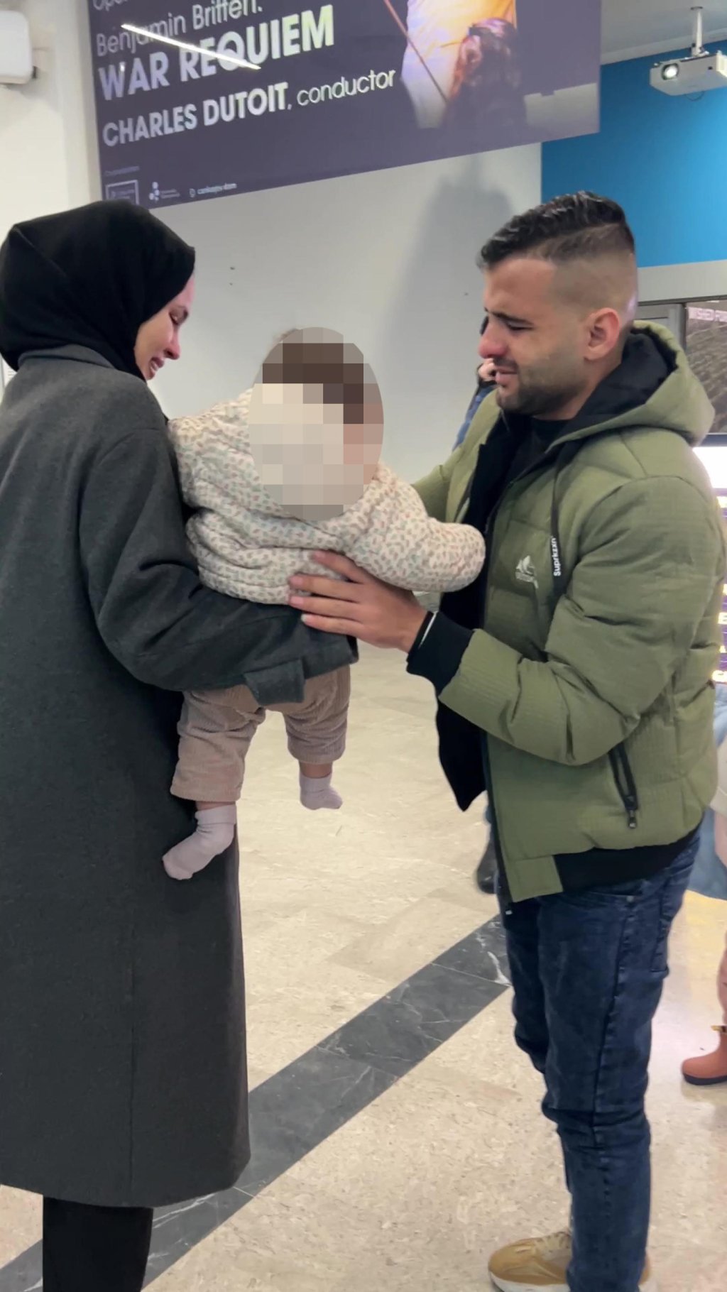 Weam and Muhammad with their young daughter Maya on Muhammad's arrival at the airport, Trieste, Italy on January 23, 2025 | Photo: ANSA
