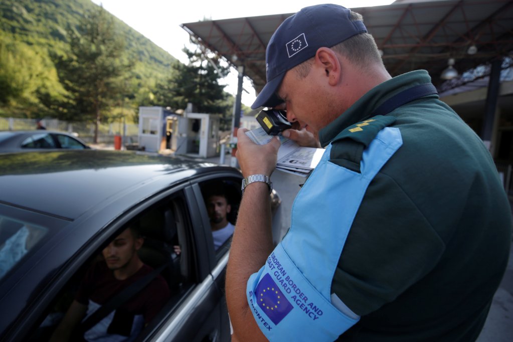 From file: A member of the European Border and Coast Guard Agency (FRONTEX) checks documents at the Albania-Greece crossing border point in Kapshtica near Korce, Albania, on July 23, 2019 | Photo: Florion Goga /Reuters
