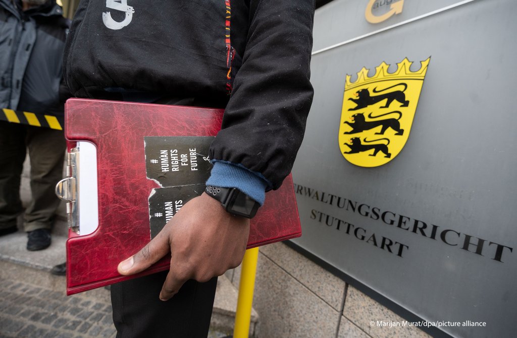 An asylum seeker from Cameroon stands in front of the administrative court Stuttgart in the German state of Baden-Wuerttemberg | Photo: Marijan Mura/picture-alliance/dpa