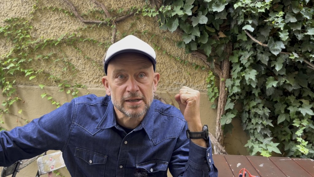 Paul Huf, artist and founder of The Long Run says: “When politicians say there are ‘too many,’ it does something to people’s minds,” he said. “It feeds the idea that helping others is a burden, when in reality, those who came here years ago are now part of our city. They work, they pay rent, they belong.” | Photo: Natasha Mellersh / InfoMigrants