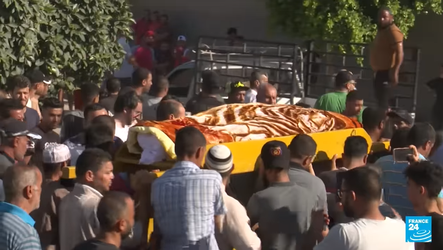 A picture of the funeral procession, young men reportedly shouted they want to avenge the death of the Tunisian man killed | Source: Screenshot of France 24 TV report