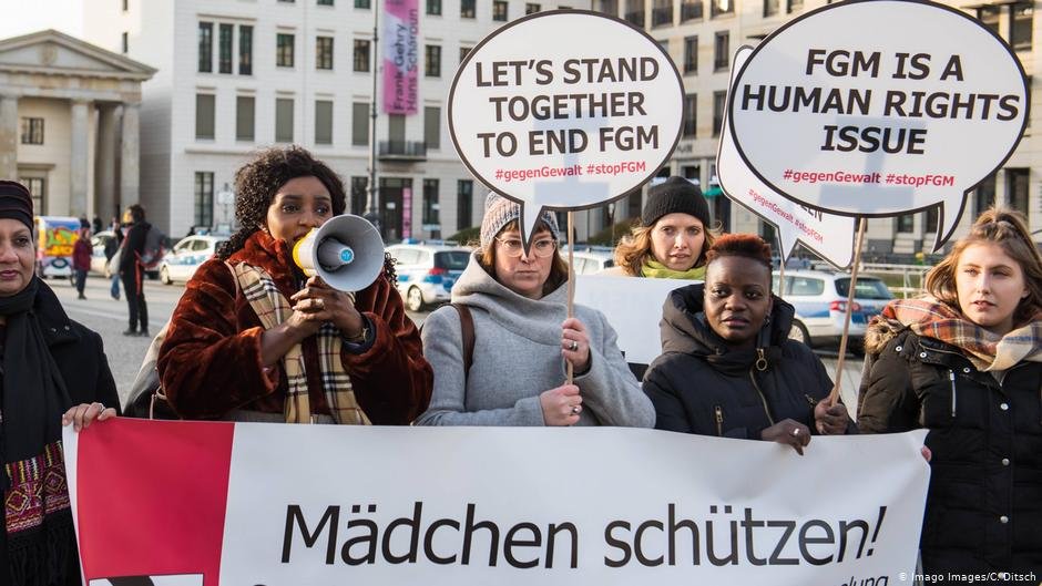 A 2019 protest by the Terre des Femme NGO in Berlin. The main German-language banner reads: 'Protect girls!" | Photo: Imago Images/C.Ditsch