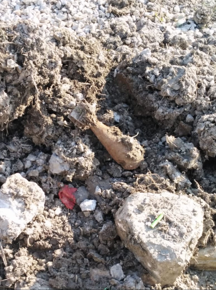 This picture from the HRW report shows a 60mm mortar found by a migrant at the camp. If moved, the mortar "could explode," said HRW | Source: HRW / Private